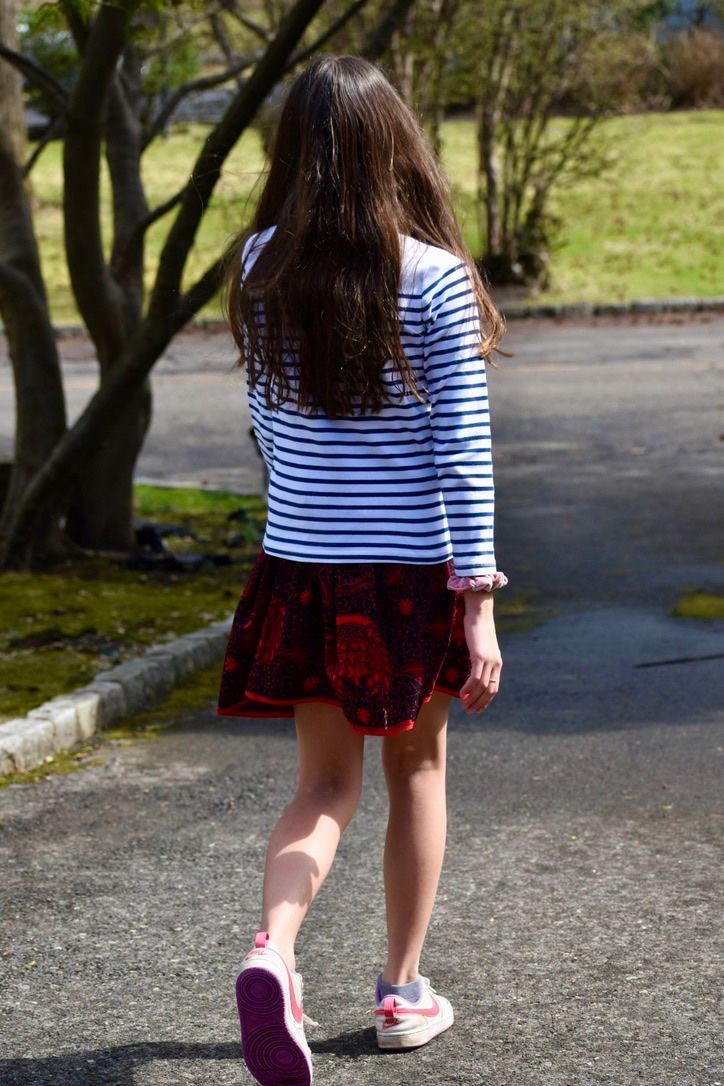 Black & red elastic mini skirt model walking