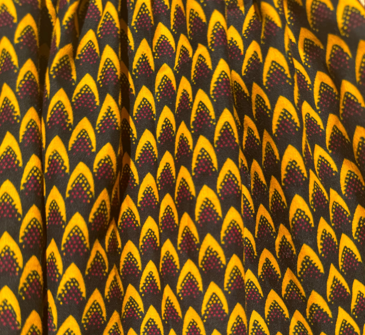Gold and purple elastic mini skirt African print close up